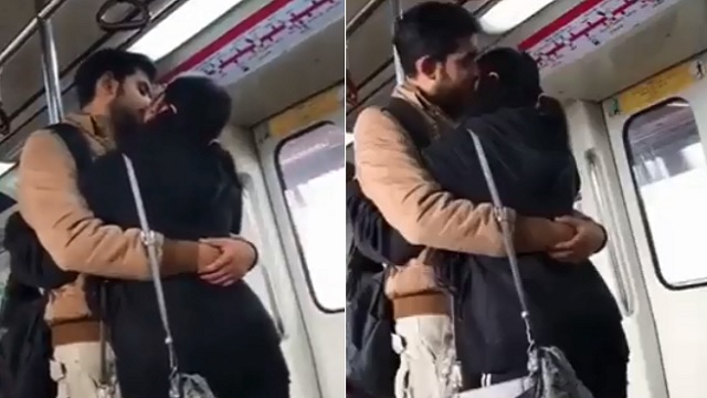 couple kissing in metro viral video