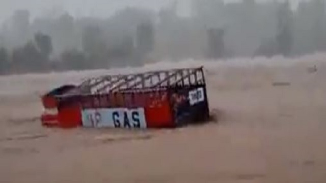 truck swept away in river